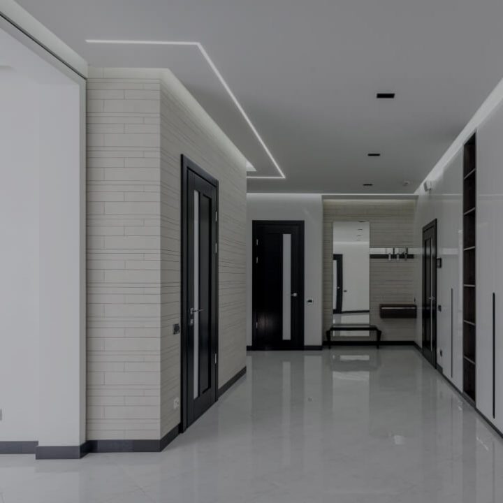 Modern hallway with recessed LED cove lighting installed in the ceiling