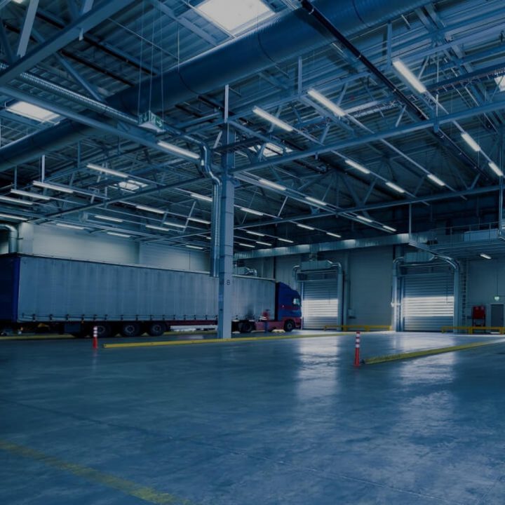 Industrial warehouse ceiling with large spiral ductwork and ventilation runs